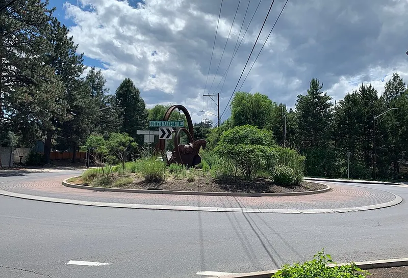 Concrete curbs and a decorative ring around the horse sculpture roundabout at Butler Market Road and 8th Street in Bend
