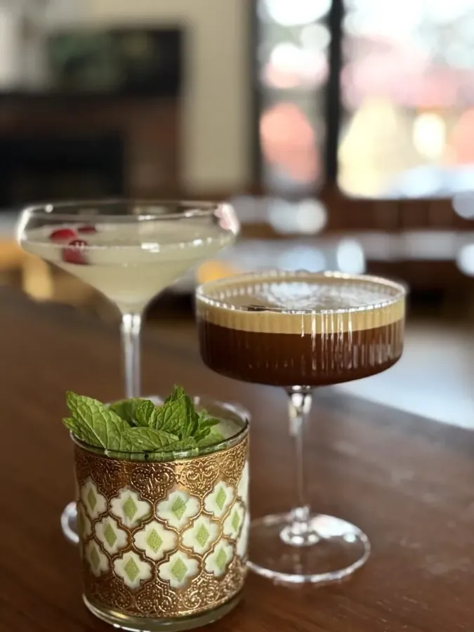 Three cocktails on the bar at Ariana restaurant in Bend