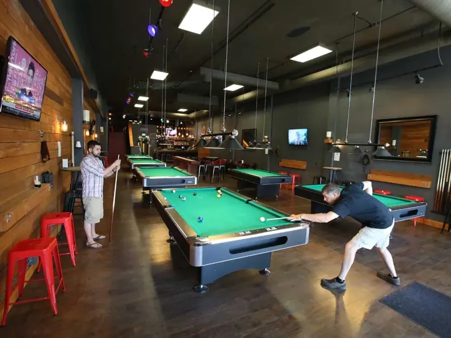 Rows of pool tables inside Duda’s Billiards Bar in downtown Bend