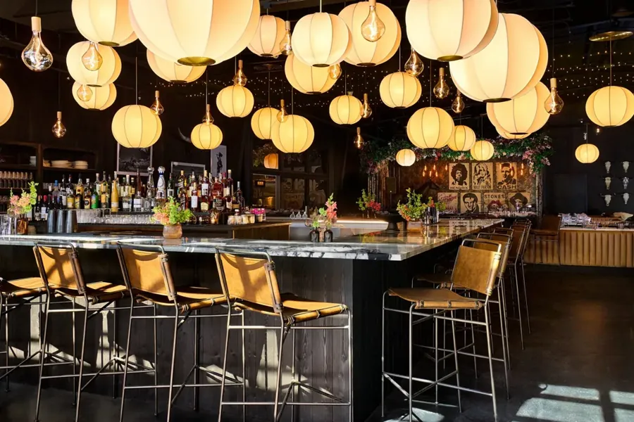 Paper lanterns hanging over the bar at Hawkeye & Huckleberry Lounge in Bend