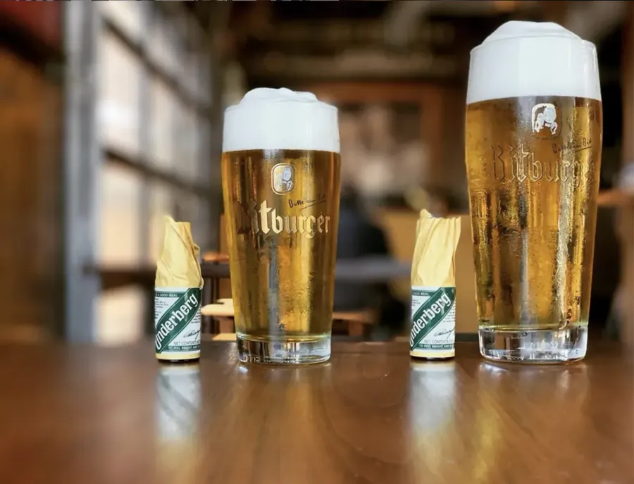 Two tall glasses of German beer on the bar at Prost! in Bend