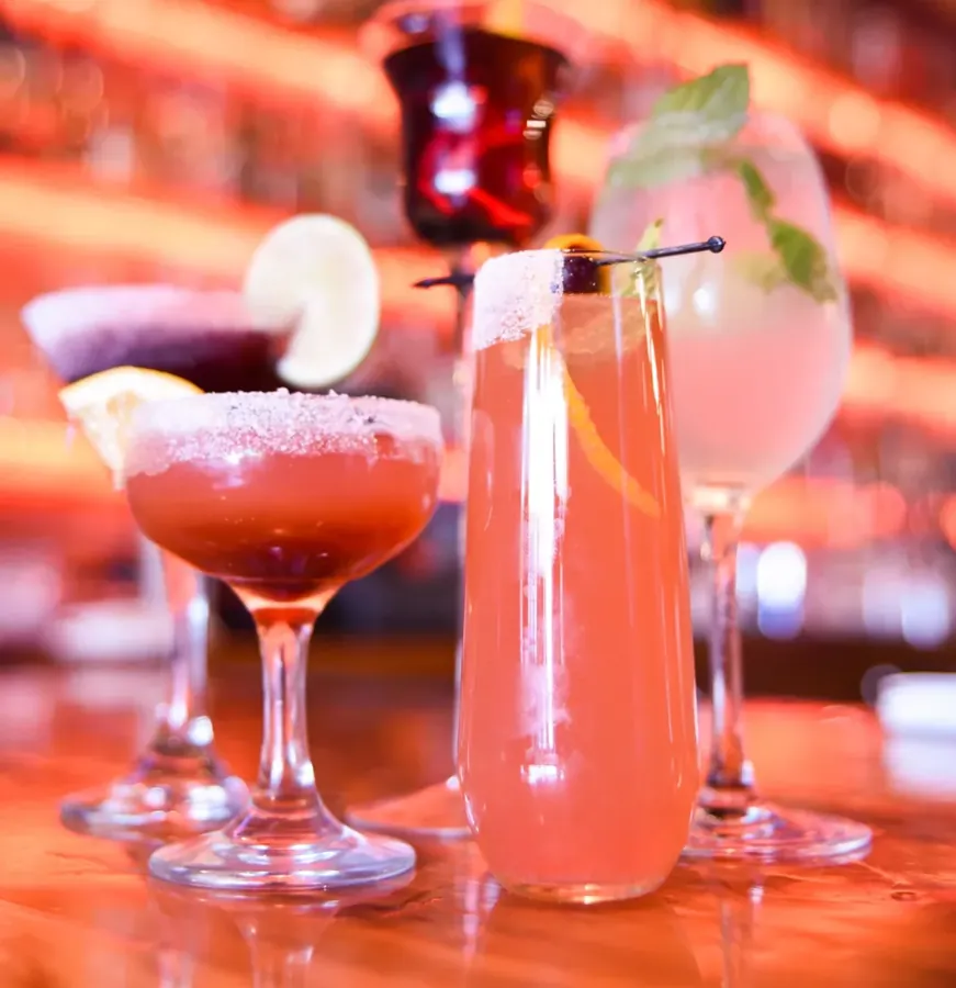 Three cocktails on the bar at The Astro Lounge in downtown Bend