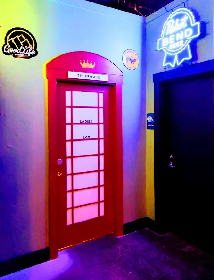 A red British phone box inside The Commonwealth Pub on Century Drive in Bend