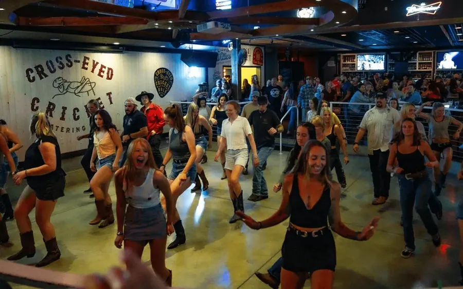Line dancers on the floor at The Cross-Eyed Cricket Watering Hole in Bend