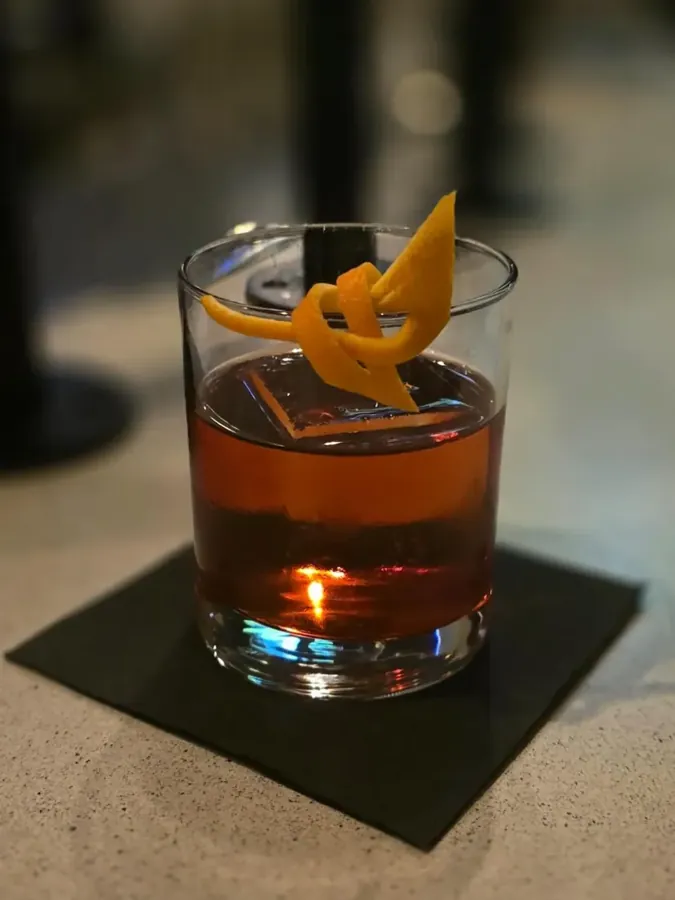 An old fashioned with an orange peel on the bar at Waypoint in NorthWest Crossing, Bend