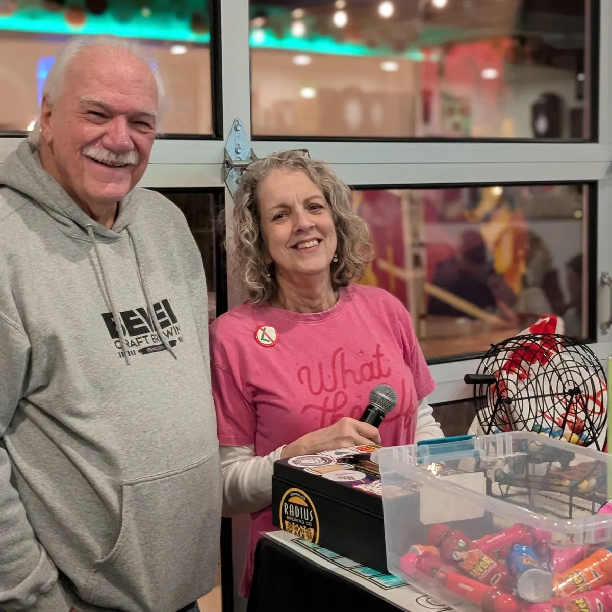 Bingo caller Bren and a helper at Bevel Craft Brewing