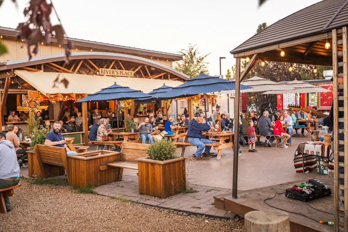 The patio and food carts at River's Place in Bend