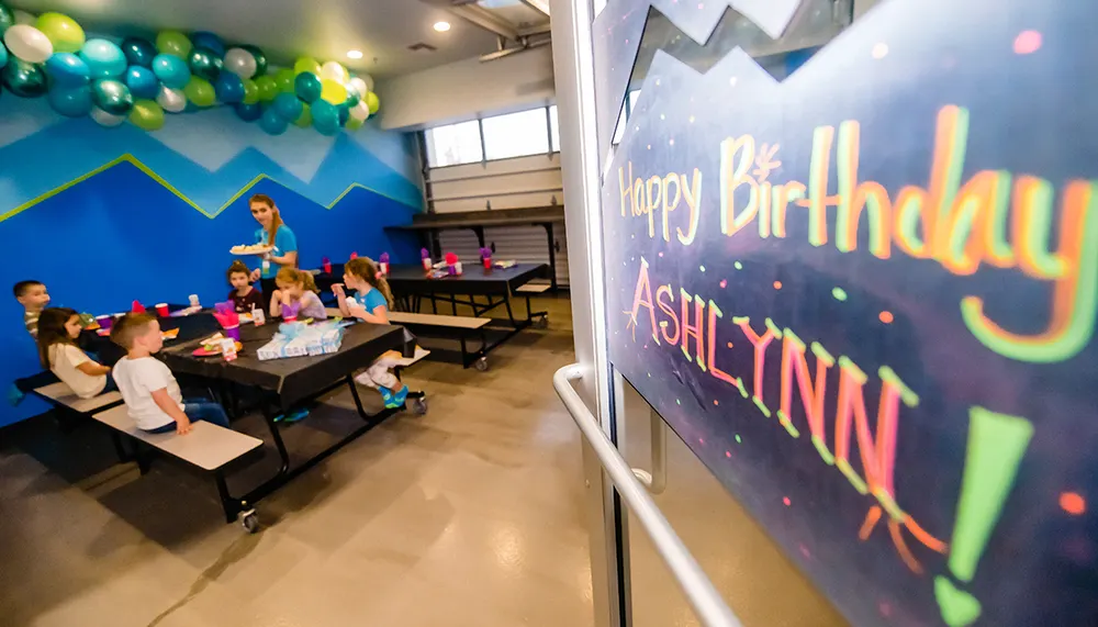 Kids at a birthday table in the party room at Mountain Air Trampoline Park in Bend