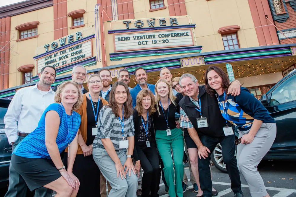 Bend Venture Conference attendees under the Tower Theatre marquee