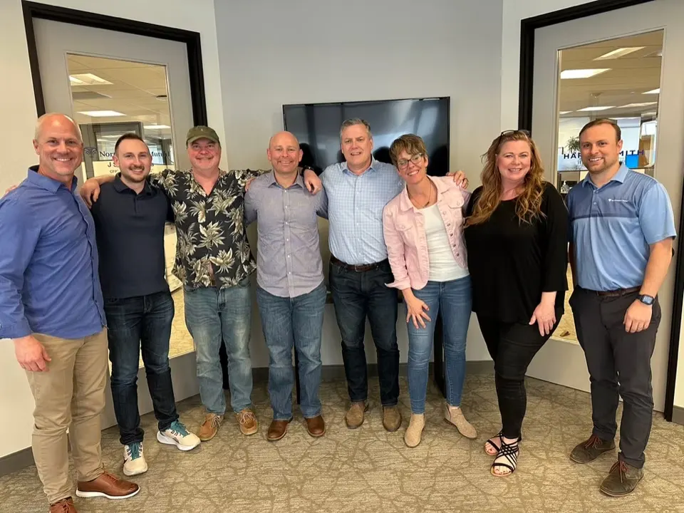 Scott McBride with a team after a staff development session