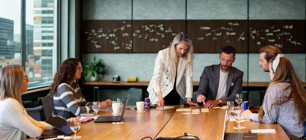 A leadership team workshop in a bright meeting room