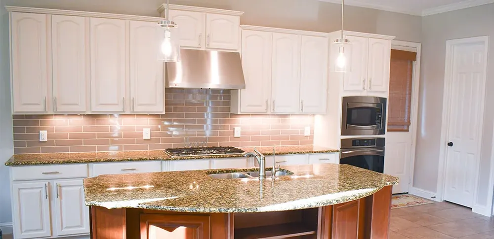 A kitchen after cabinets were painted white by Kitchen Tune-Up