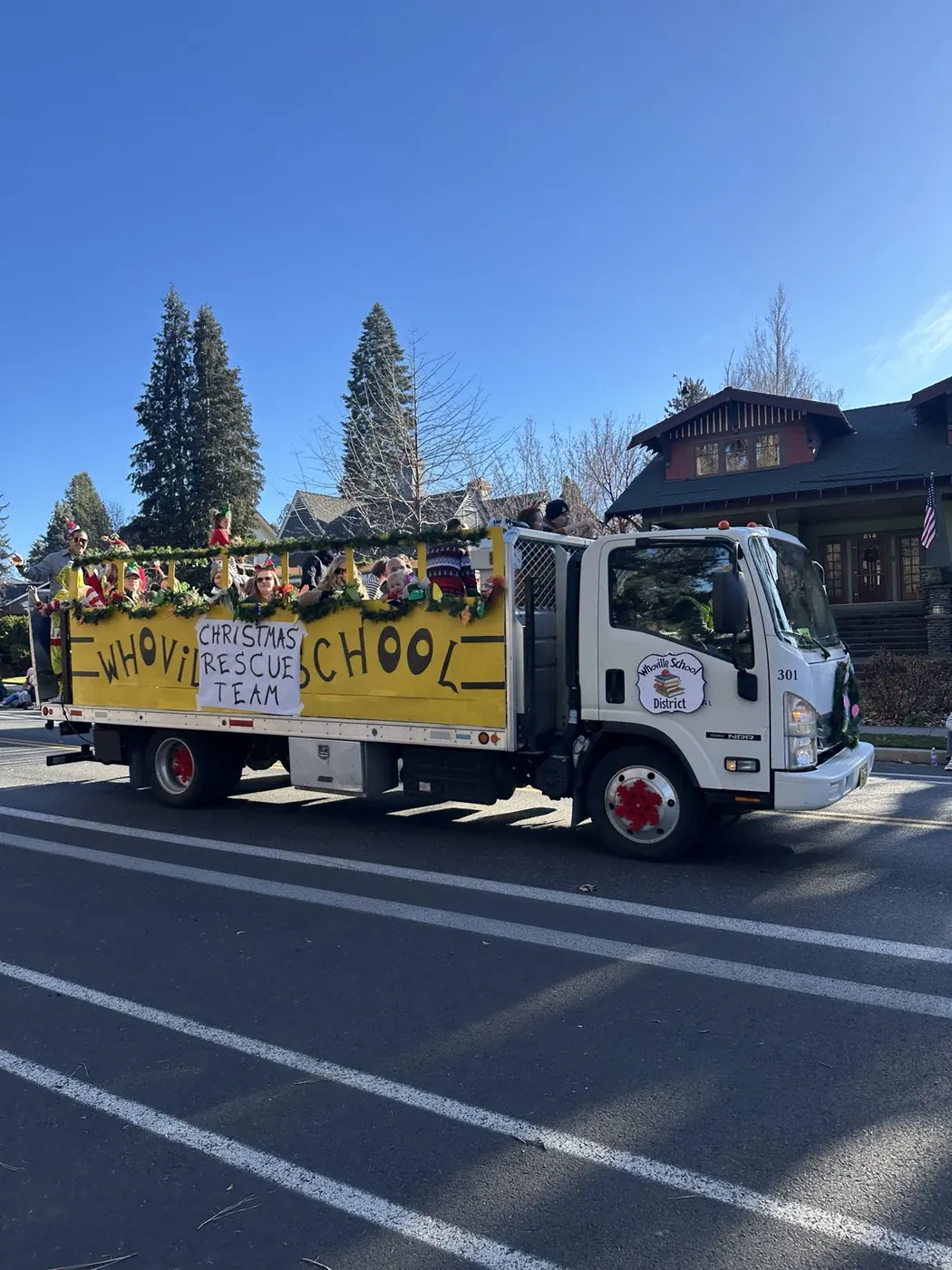 A float rolling through downtown in the Bend Christmas Parade