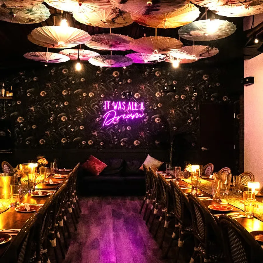 The paper umbrella ceiling and long tables in the Moon Room at JIA Asian Street Kitchen