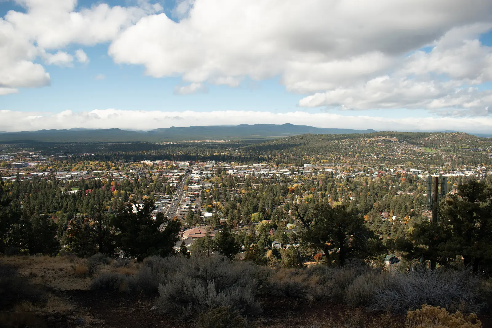 Bend, Oregon seen from Pilot Butte in fall, with ponderosa pines and the Cascade foothills behind