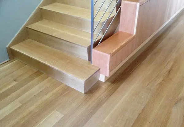 Light oak stair treads and risers matched to an oak floor