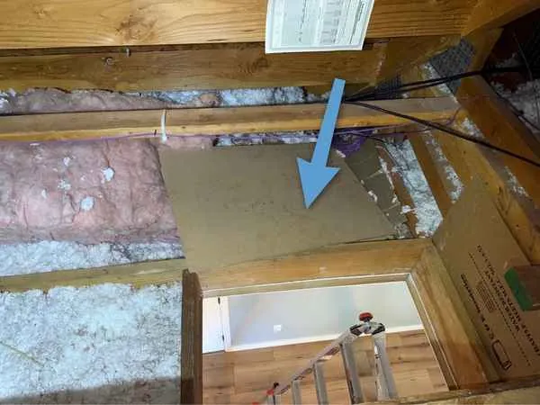 Attic access hatch with no insulation on the back of the panel