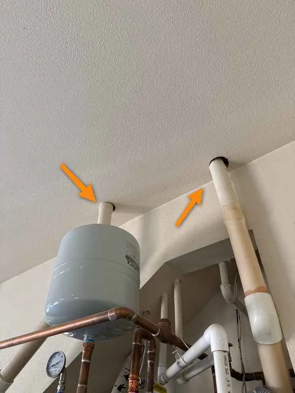 Gaps around plumbing vent pipes through a garage ceiling