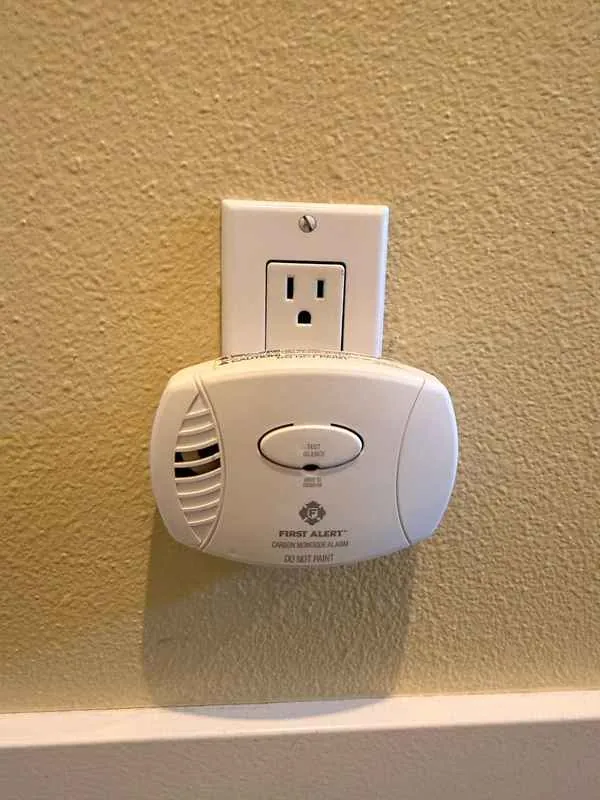 Plug-in carbon monoxide alarm in a wall outlet