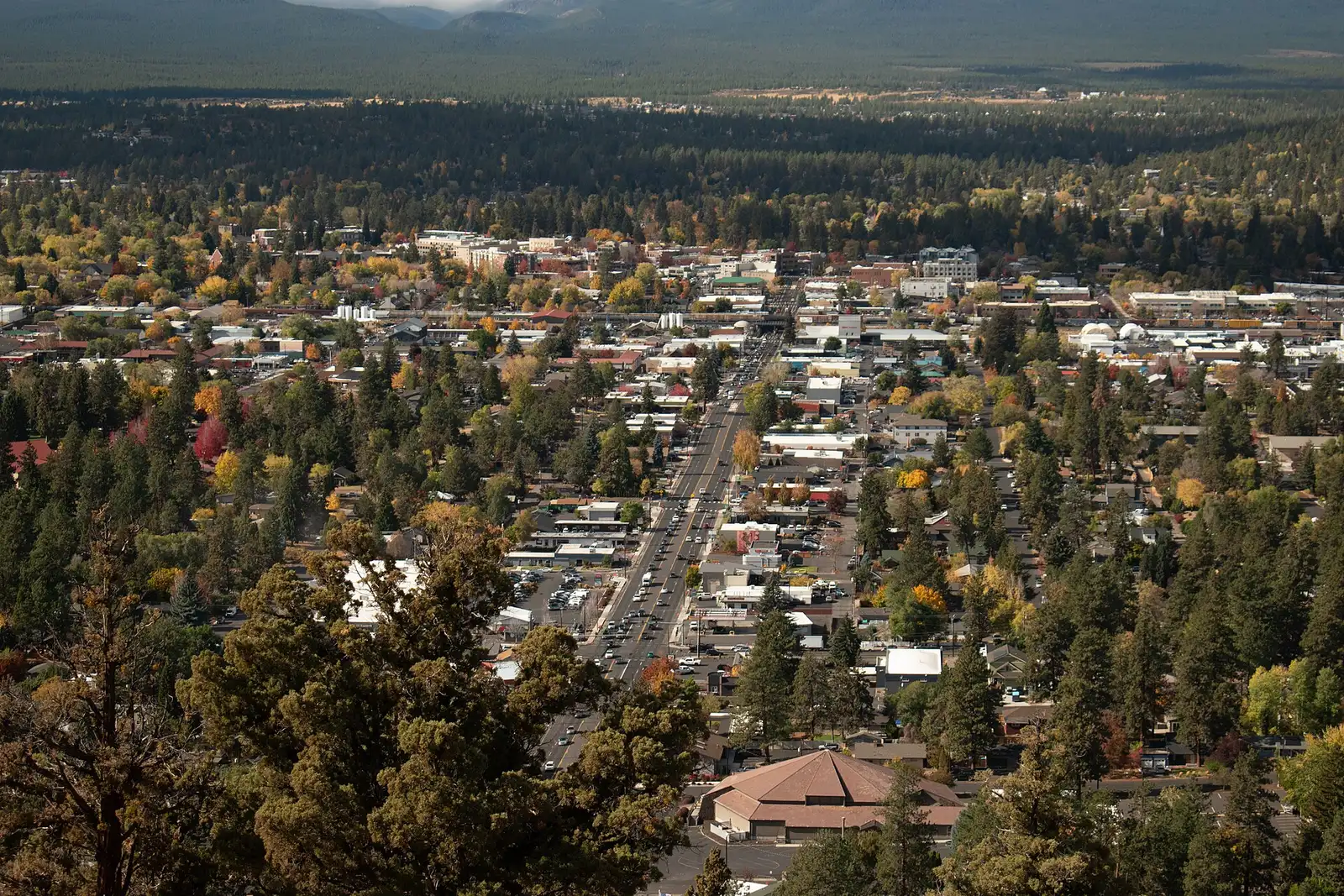 Fall color over Bend’s central neighborhoods, looking west from Pilot Butte toward downtown and the Cascade foothills