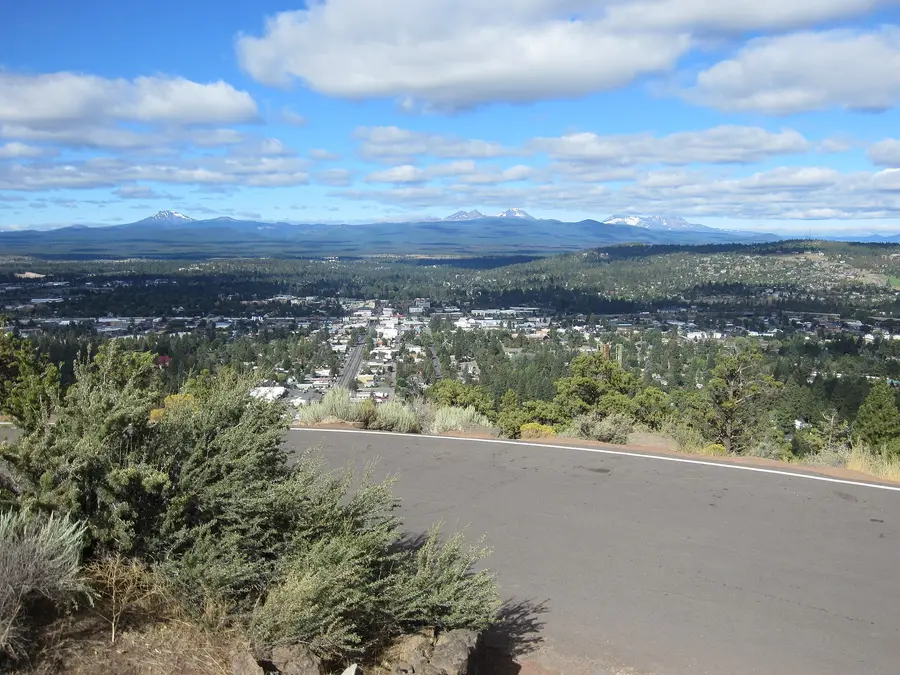 The view west from the Pilot Butte summit road over Bend to the Cascades