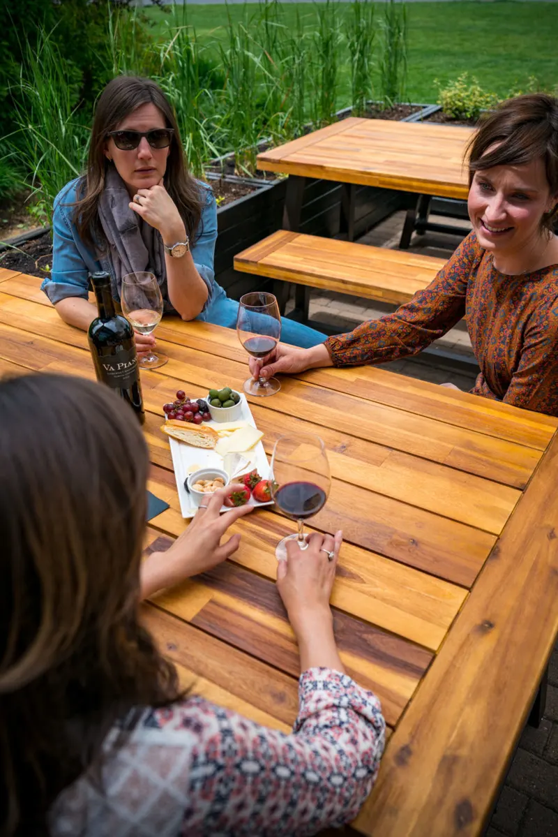 Red wine and a cheese plate on Va Piano’s Old Mill District patio