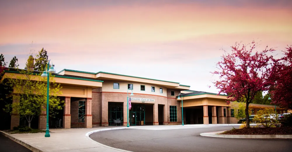 The Athletic Club of Bend building at sunset