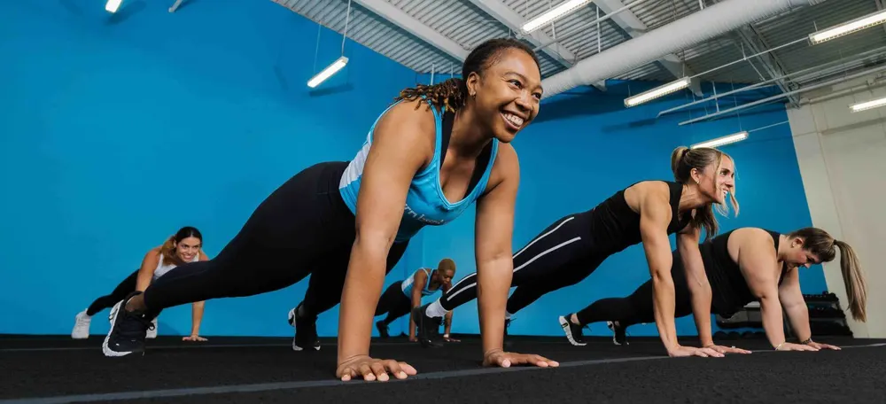 A Burn Boot Camp class doing mountain climbers