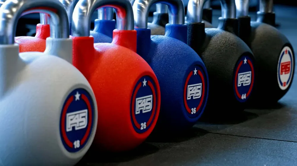F45 kettlebells lined up on the floor