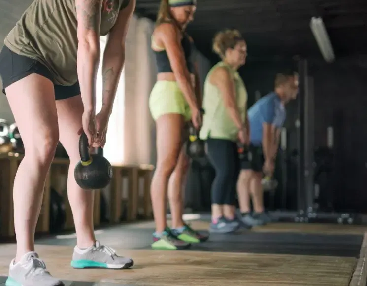 Kettlebell deadlifts during a class at Strength Warehouse