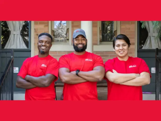 Three Ace Handyman Services technicians in red shirts