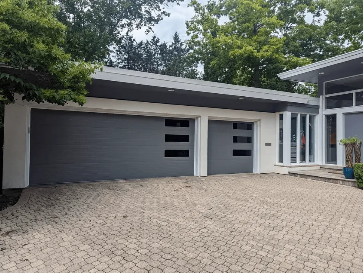 A modern gray garage door on a Bend home