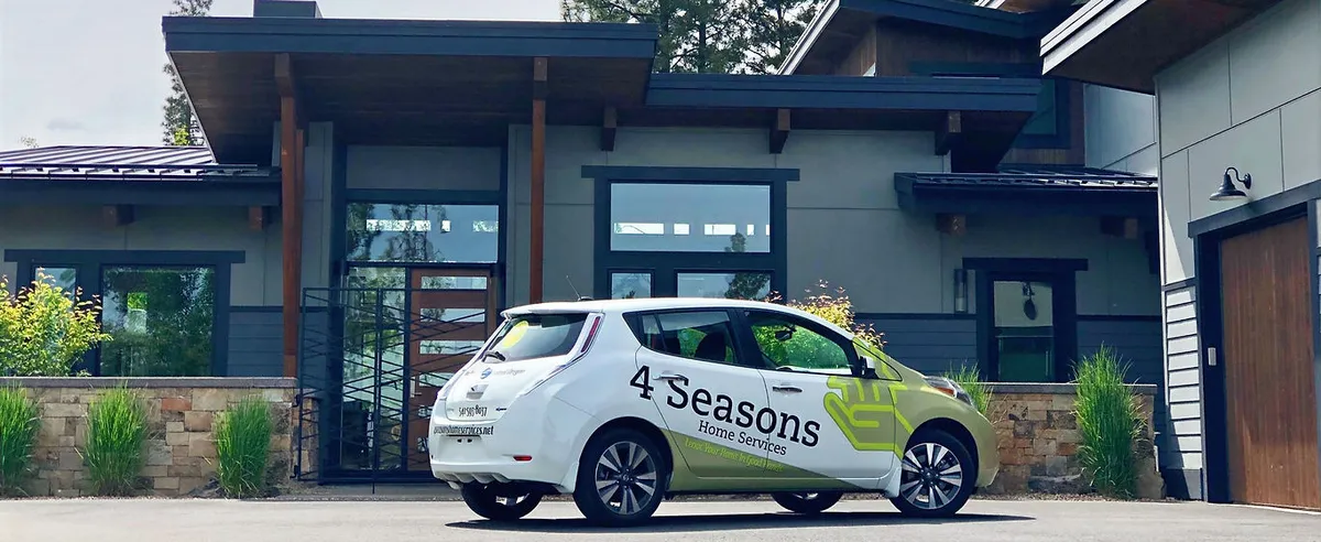 A 4 Seasons Home Watch car parked at a Central Oregon home