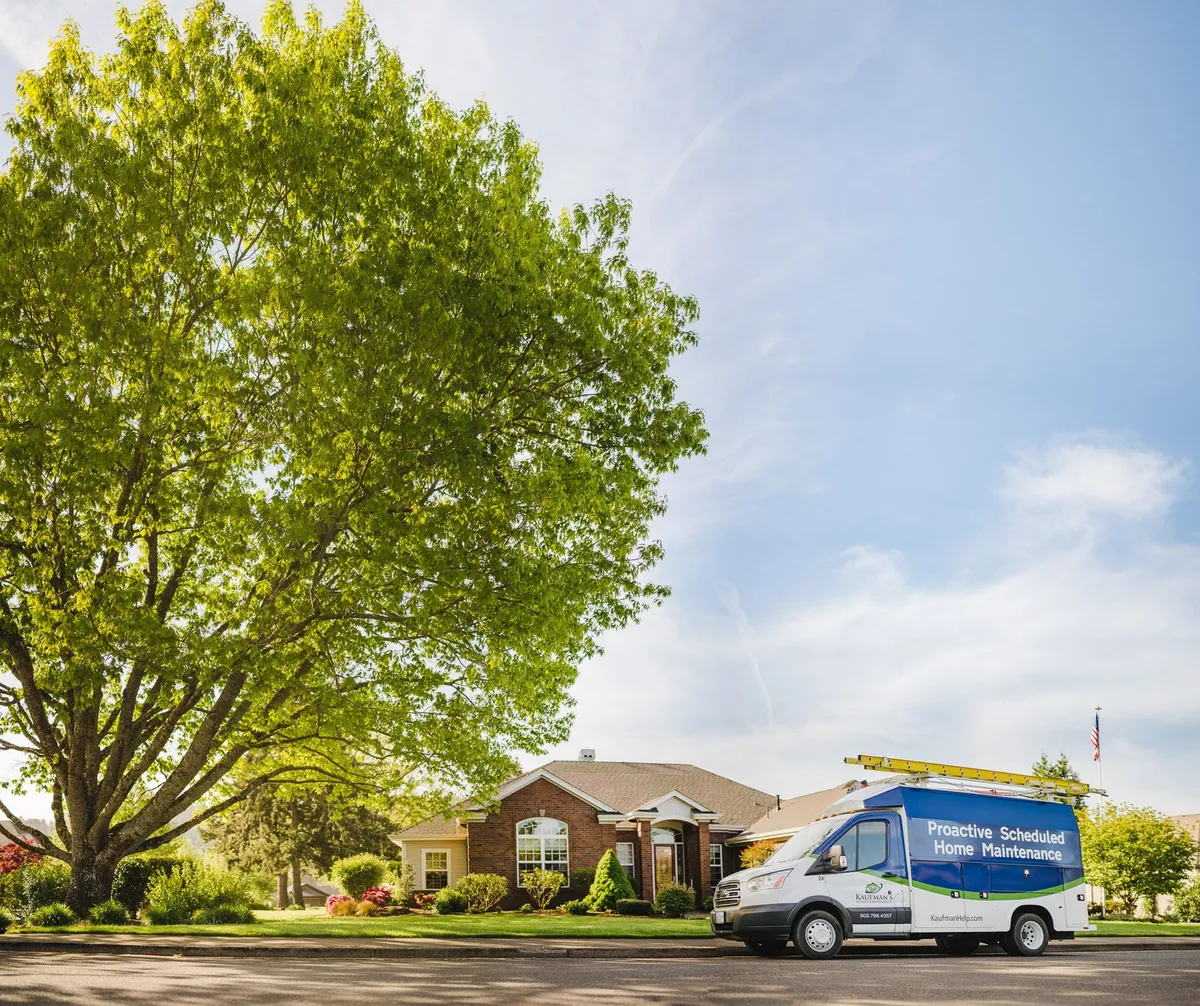 A Kaufman's Home Maintenance van parked at a home