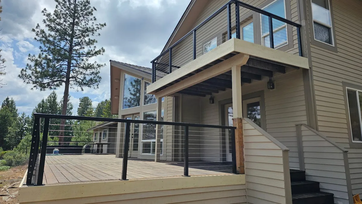 A deck with new cable railing on a Central Oregon home by The Maintenance Man