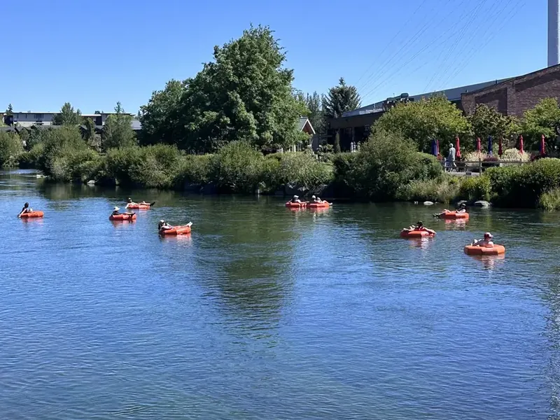 People floating the Deschutes River through the Old Mill District