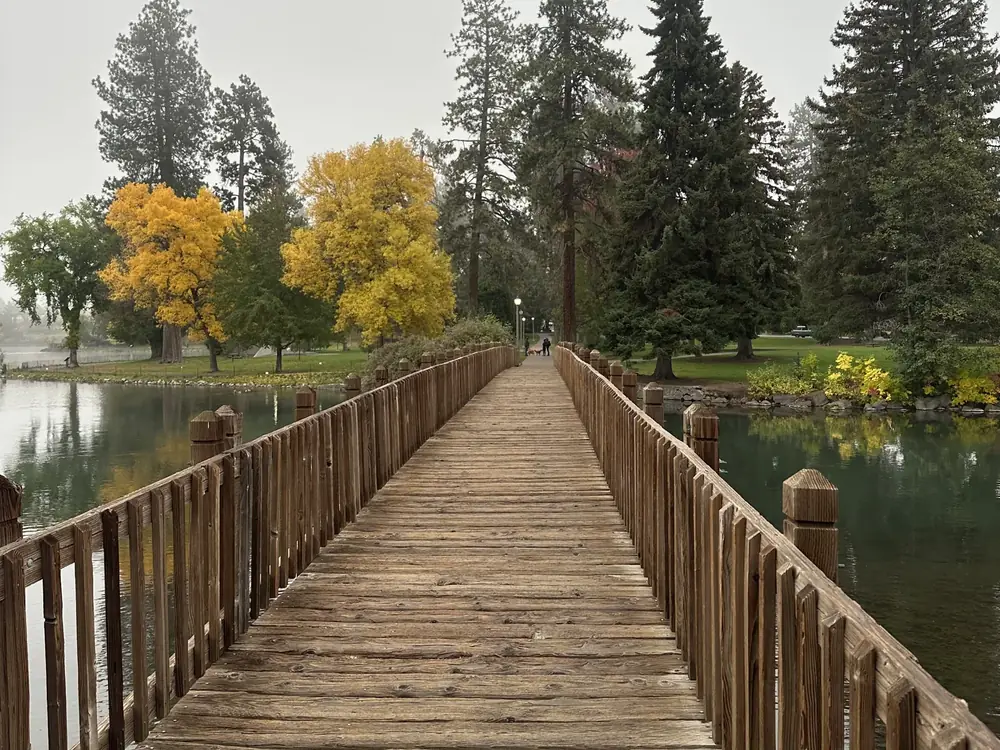 Fall color along a wooden footbridge in Bend, Oregon
