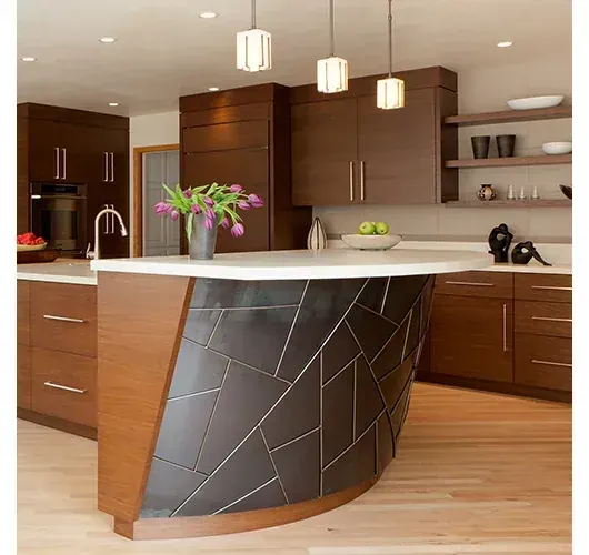 A kitchen with a curved wood and metal island by Martha Murray Design in Bend