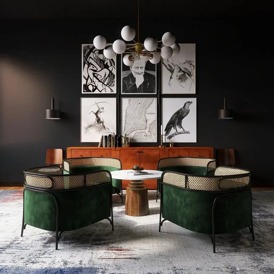 A dark lounge with green velvet chairs and bird prints by Willem Hendrik Design