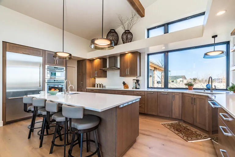 Warm wood kitchen with a large island by Brian's Cabinets
