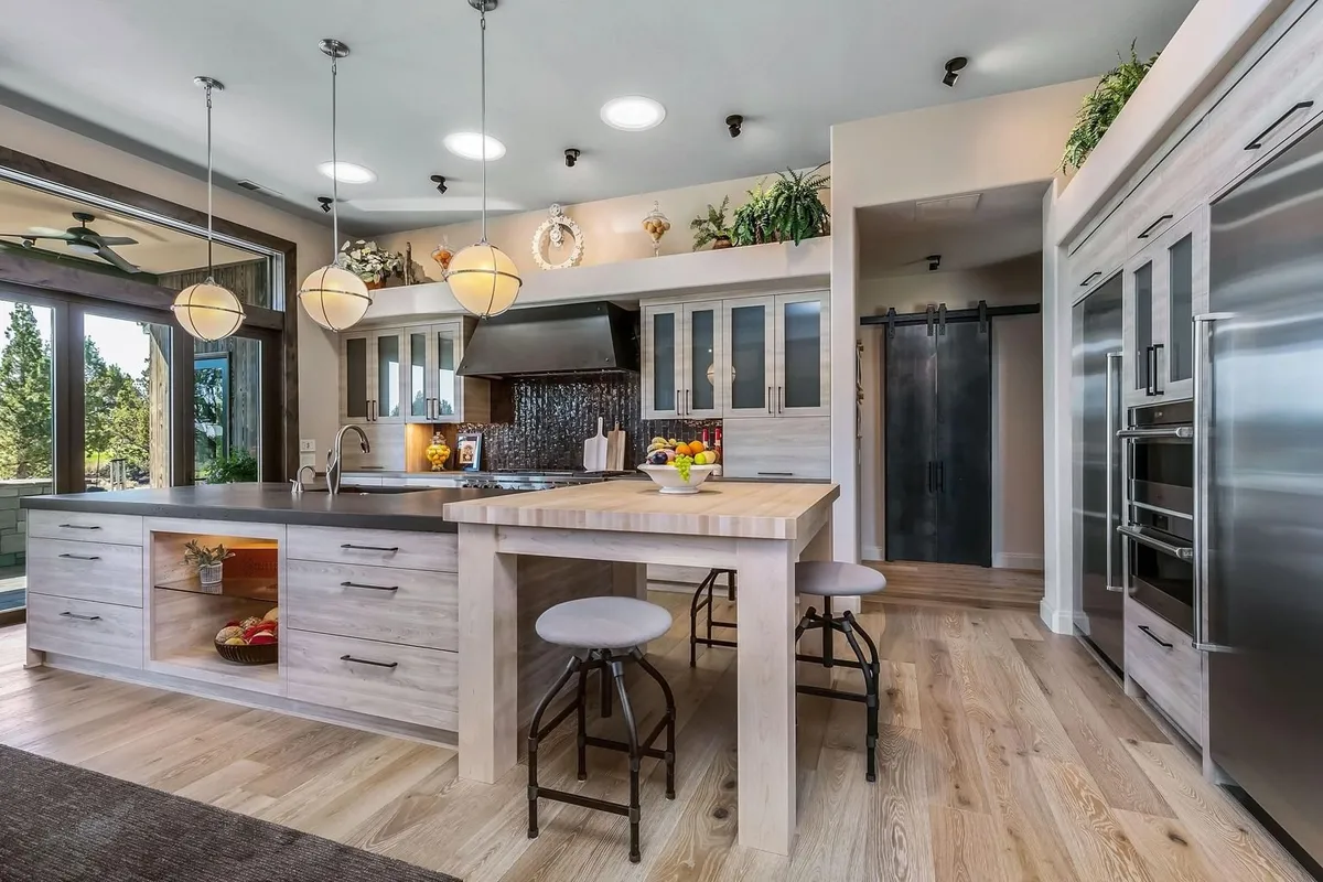 Kitchen island and custom cabinetry by Deschutes River Cabinet & Closet