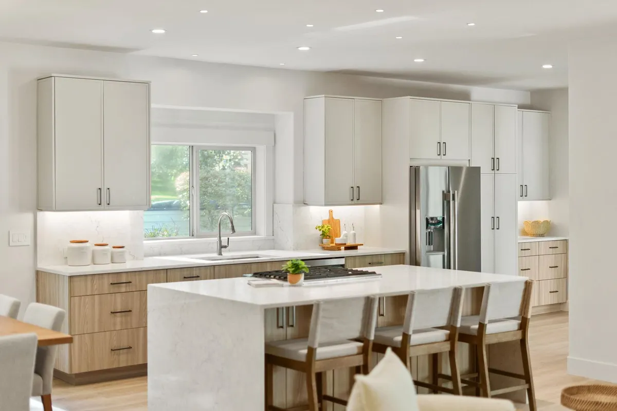 White oak kitchen with a quartz waterfall island by Nelson Tile & Stone
