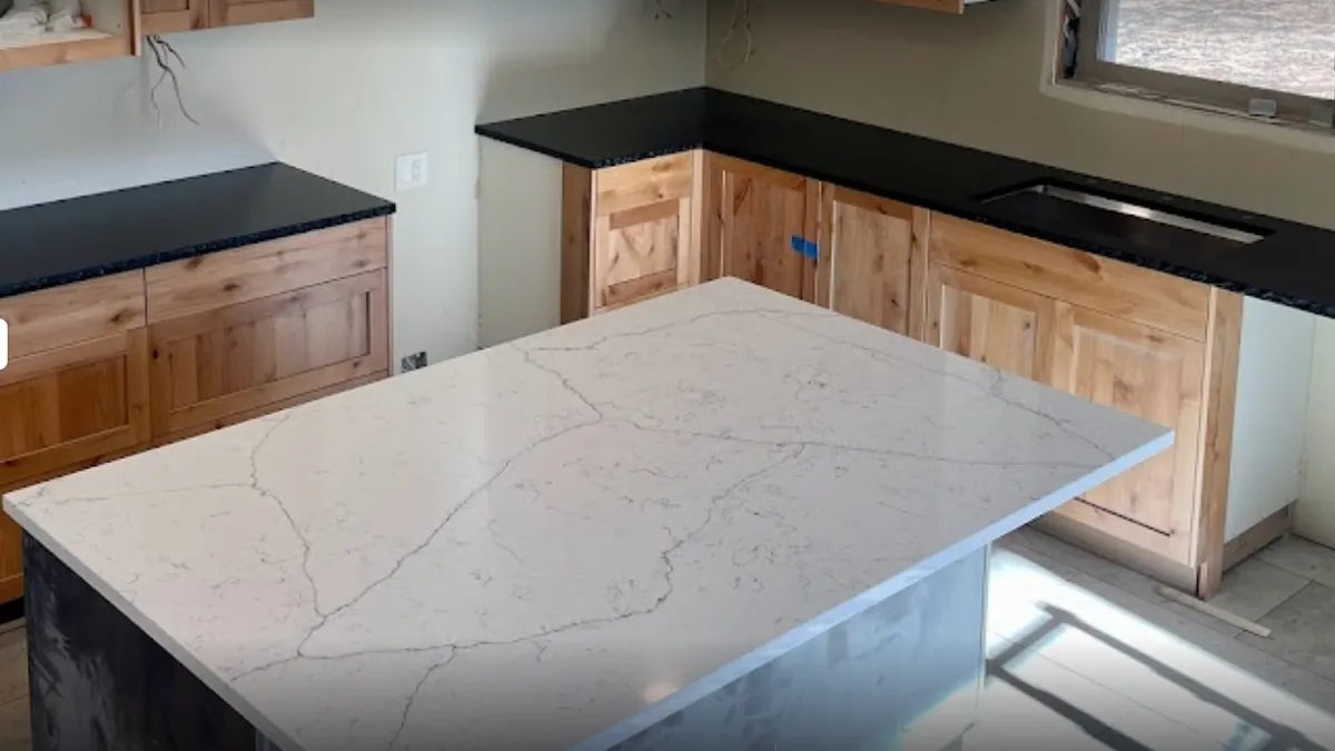 White quartz island with veining by New Era Granite