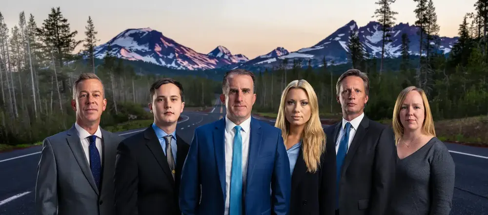 The High Desert Law team with the Cascades behind them