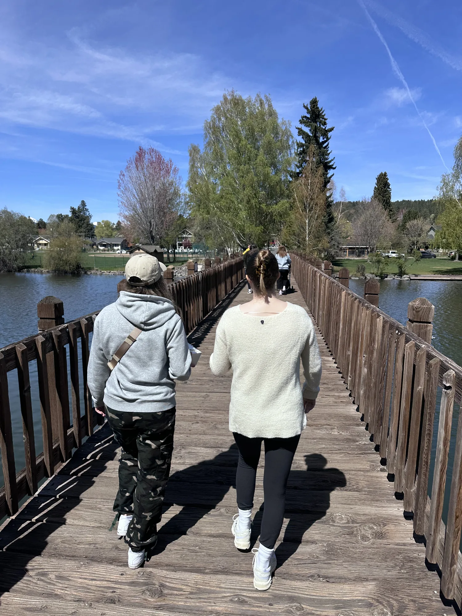 People walking across a bridge in Bend, Oregon
