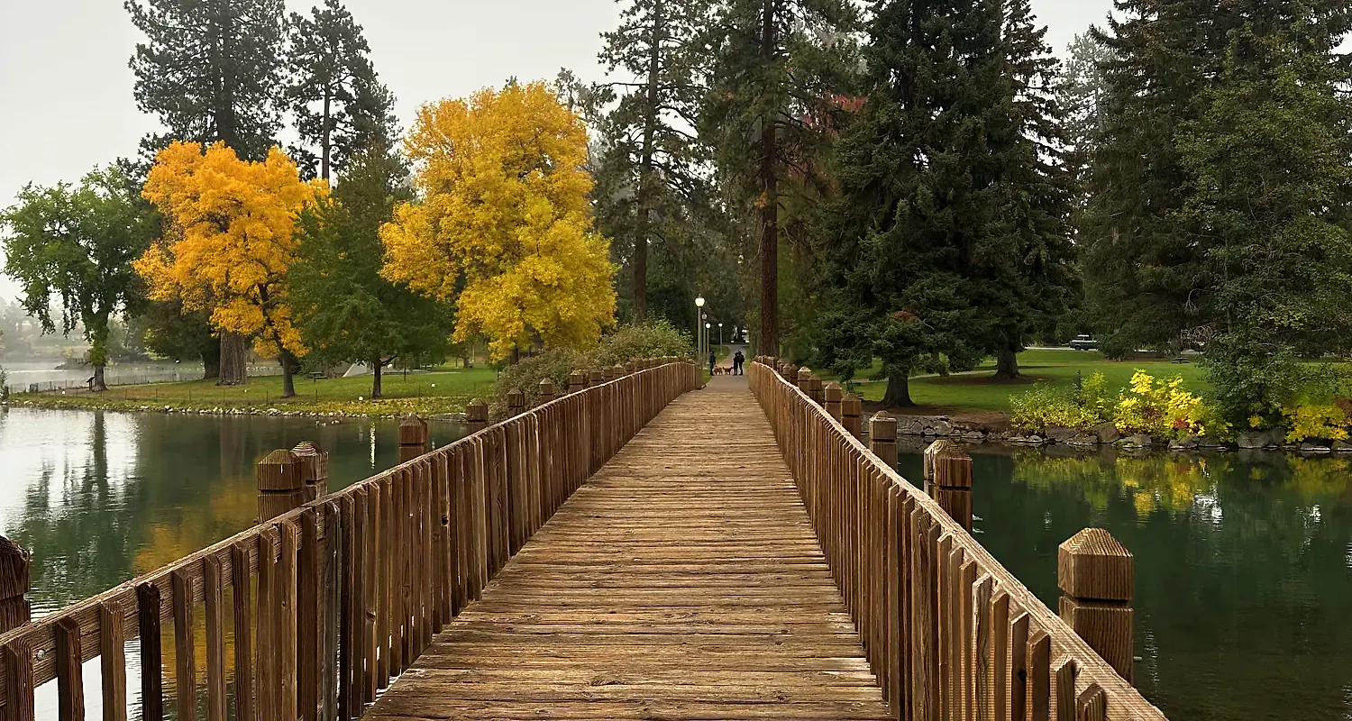Wooden bridge over the Deschutes River at Drake Park in Bend, Oregon