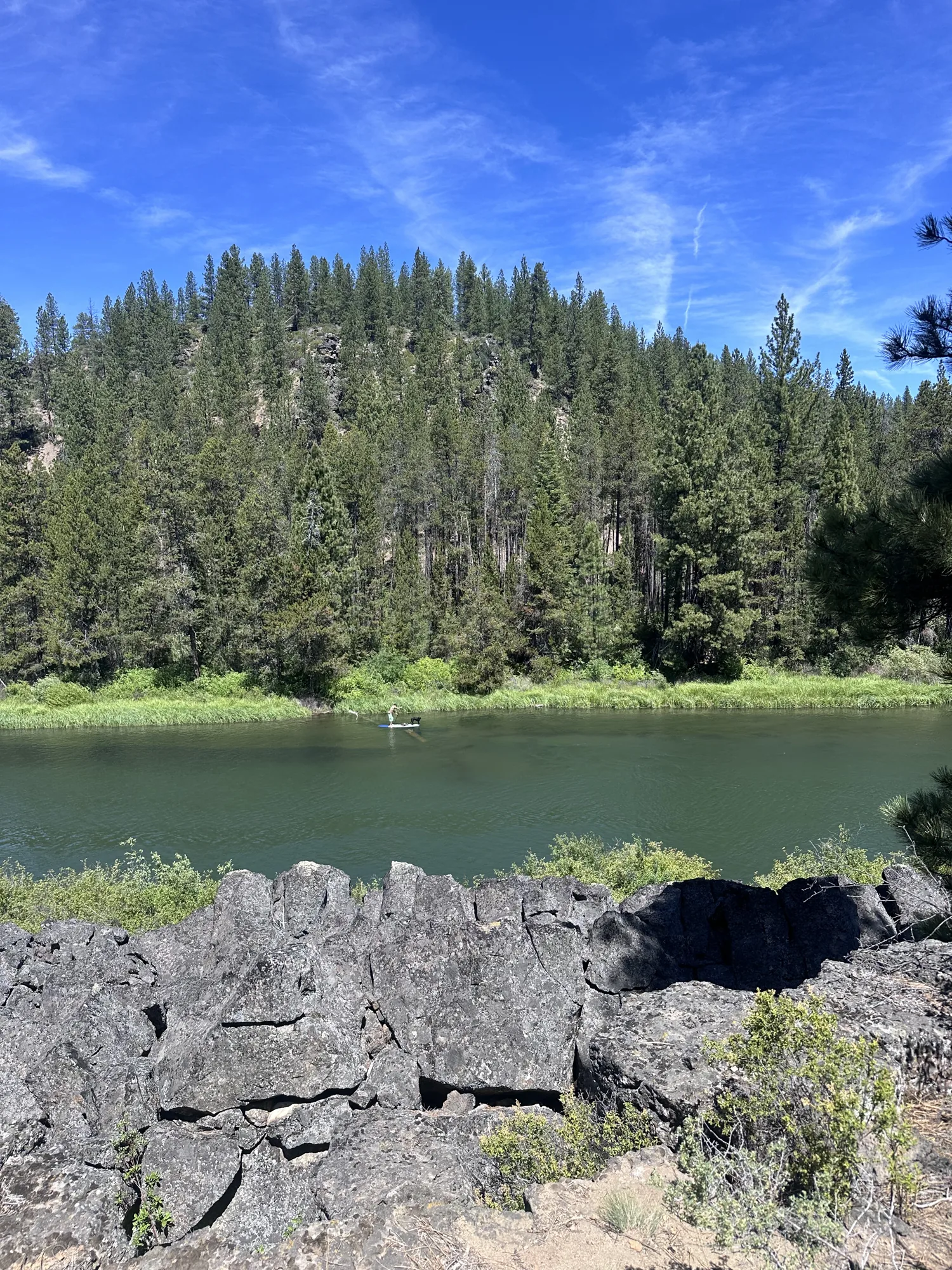 Rocky volcanic lake and forest scenery in Central Oregon