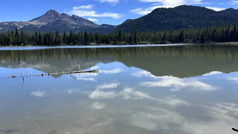 Cascade peaks reflected in a calm high lake