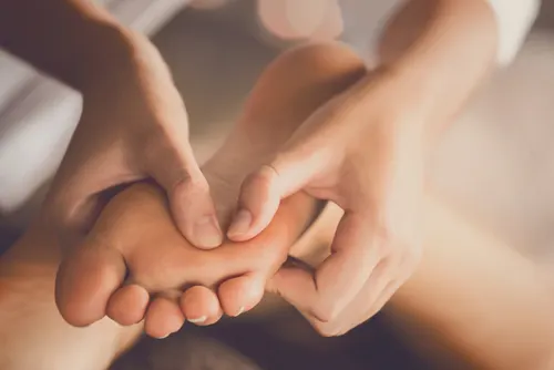 A foot massage with warm oil