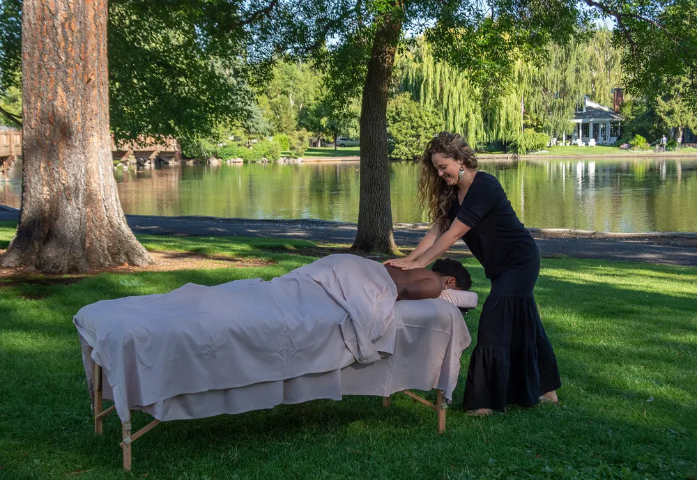 A massage table set up on the lawn at Drake Park in Bend